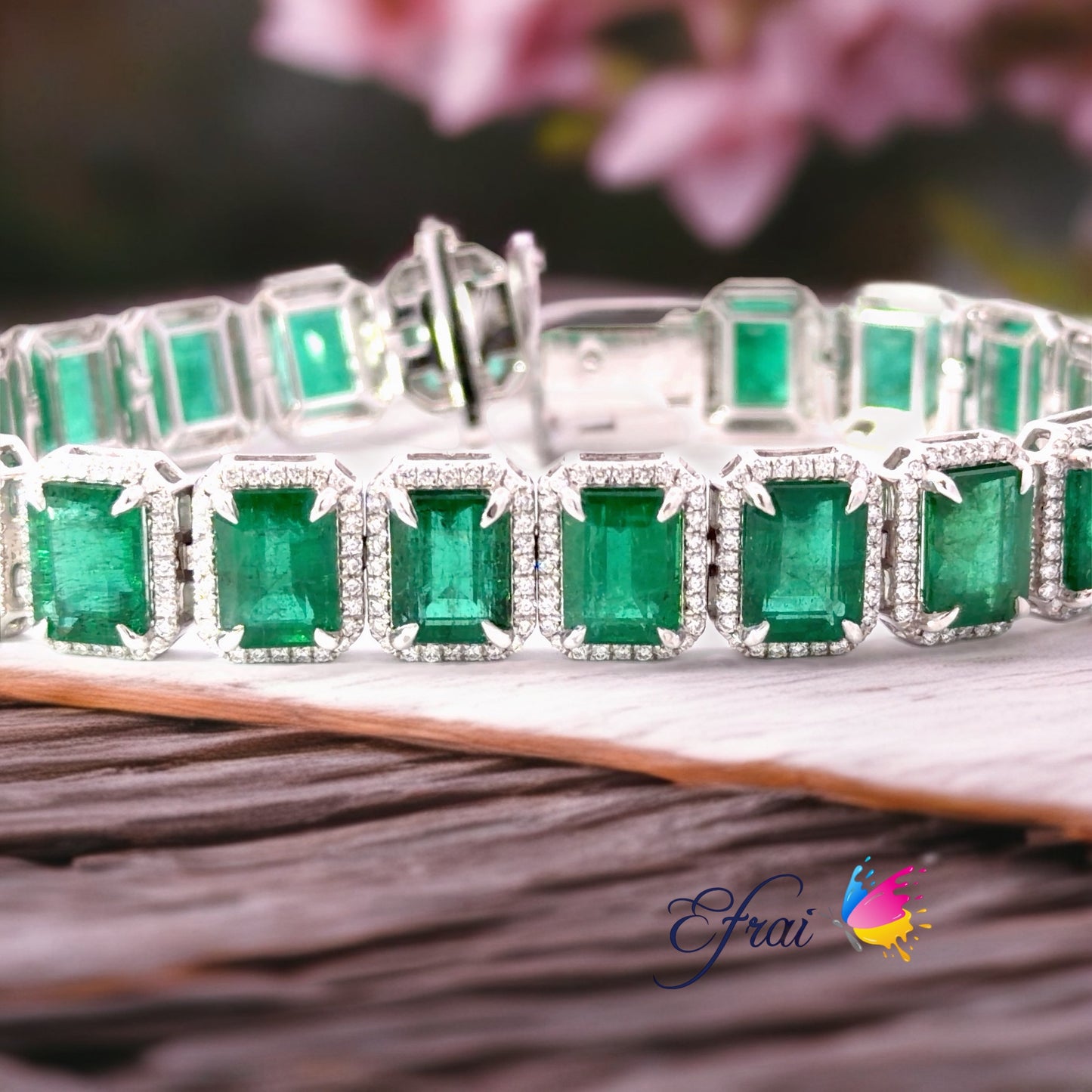 Natural Emerald cut Emeralds and Diamonds Halo Link Bracelet in White Gold