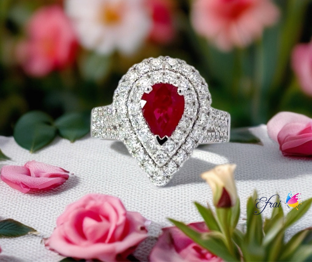 Natural deep red pear shaped ruby and diamonds ring