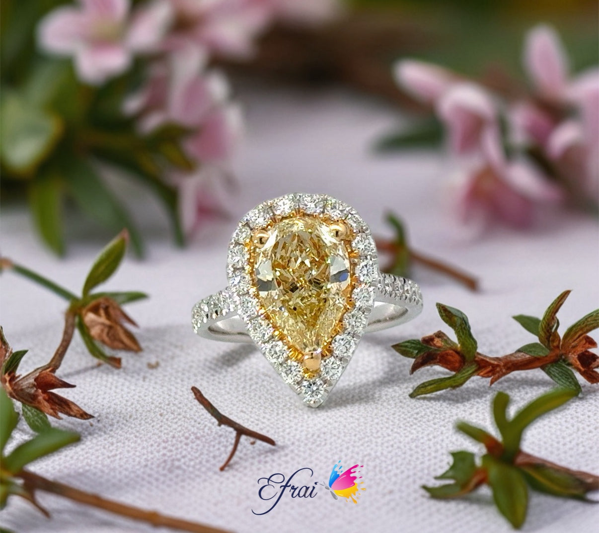 GIA pear shaped fancy yellow diamonds ring