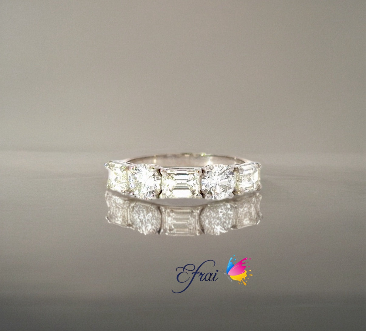 Natural Emerald Cut and round Diamonds Ring