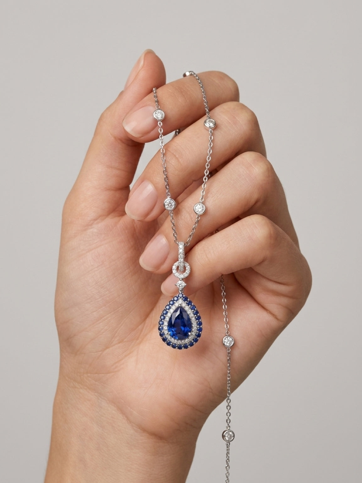 Natural Royal Blue Sapphire Pear Halo Pendant Necklace — White Gold